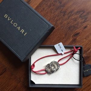 Bvlgari bracelet with adjustable red band.